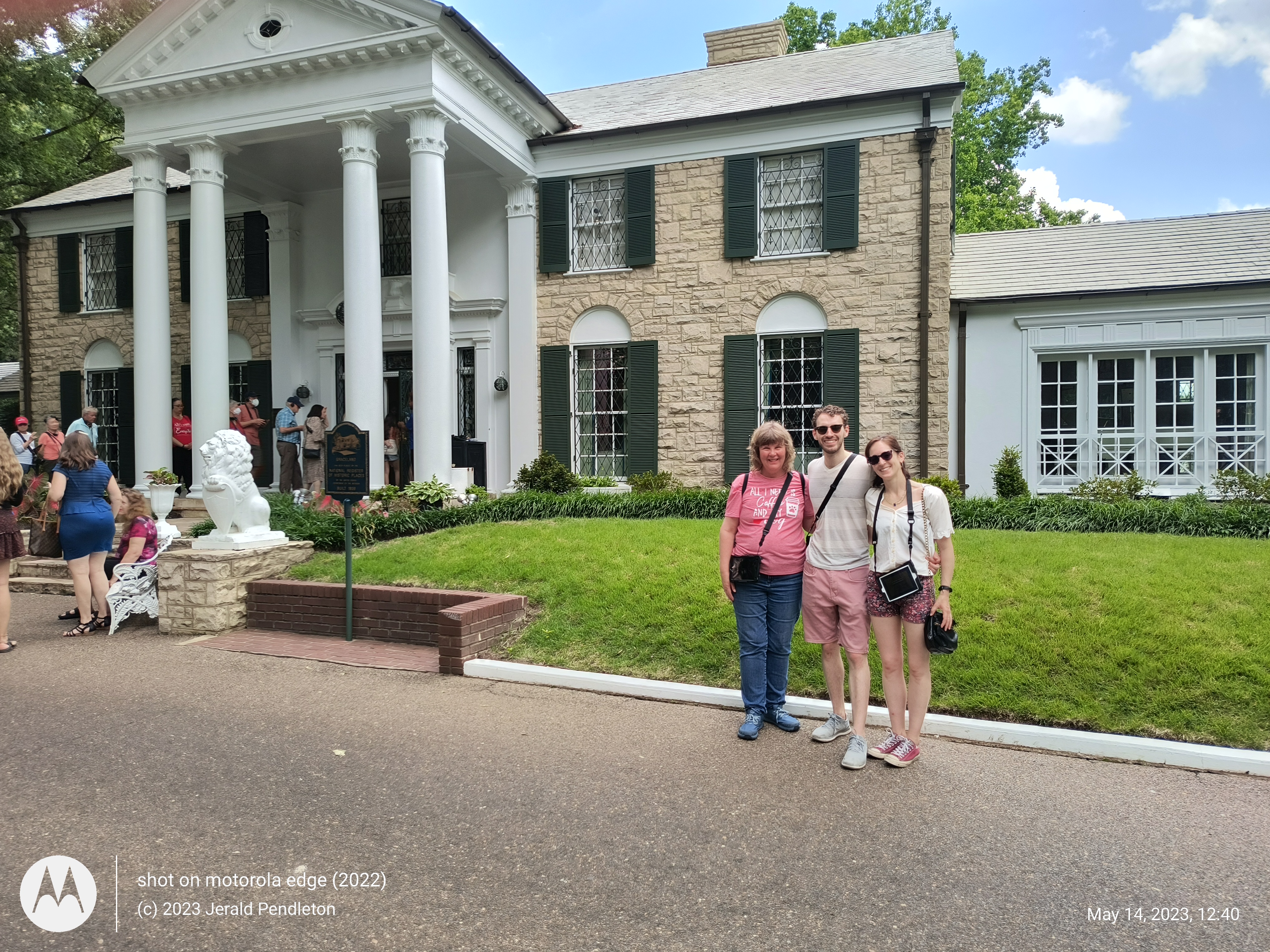 Picture of Wyatt, Claire and Jess in front of Graceland