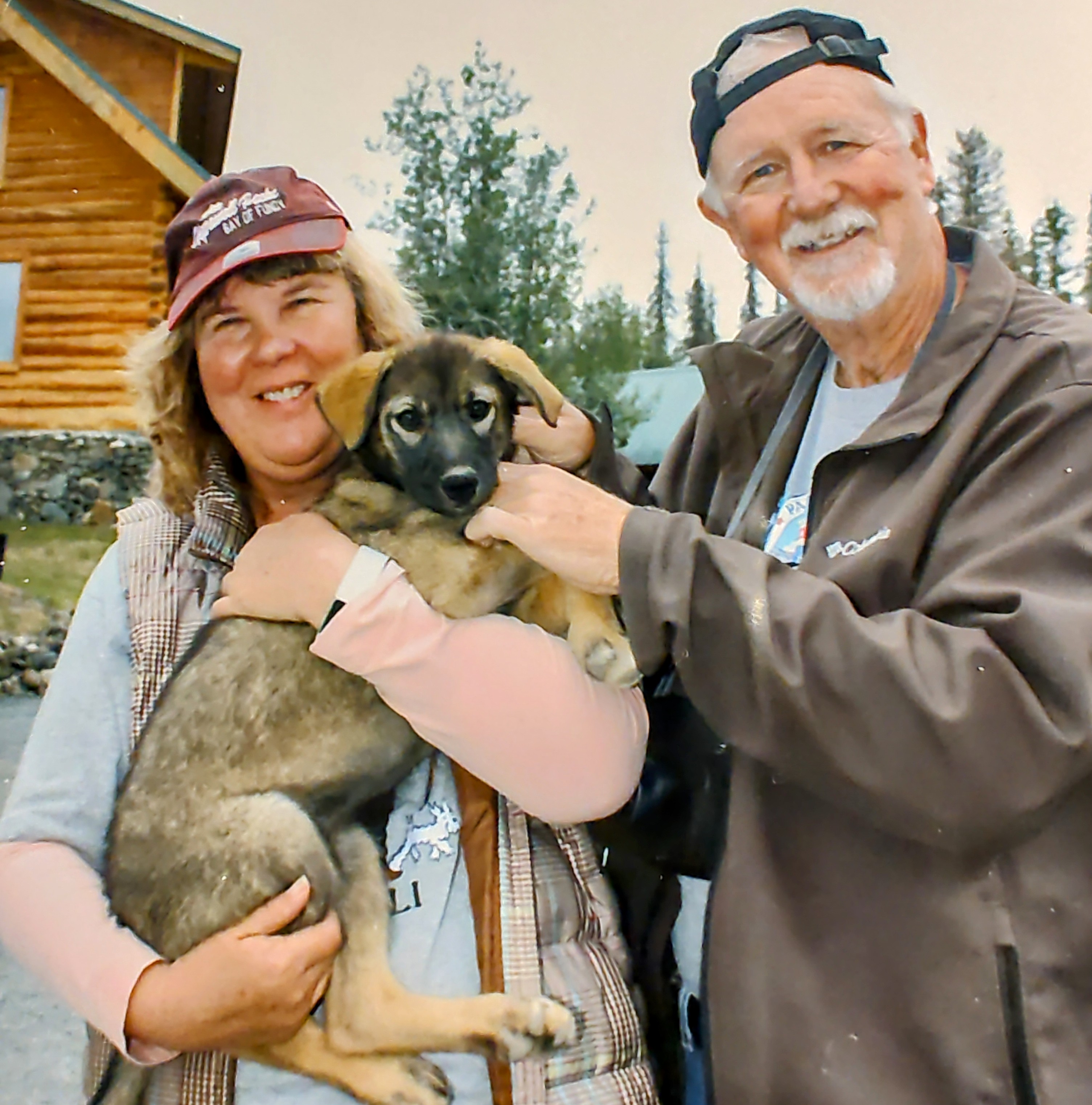 Jerald and Claire with a puppy.